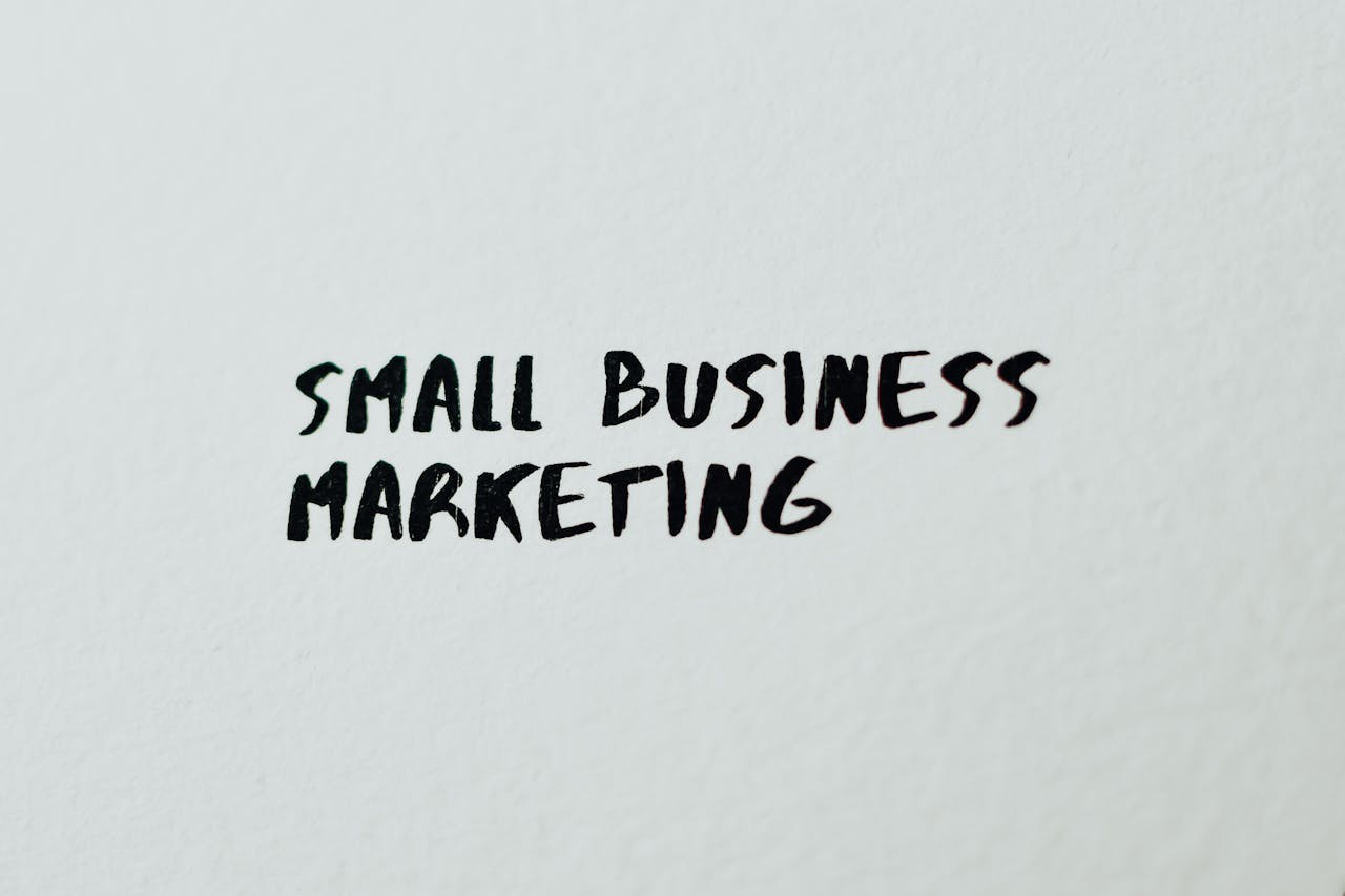 services-04 Text 'Small Business Marketing' written on white paper for creative use.